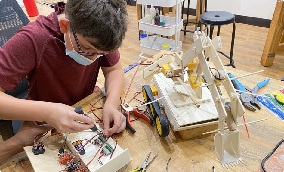 Student working on Fighting Tank Excavator
