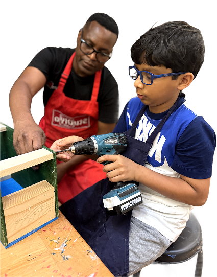 Teacher guiding student with woodworking